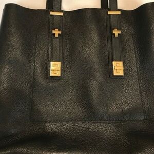 India Hicks black leather tote bag. Adjustable straps/length.